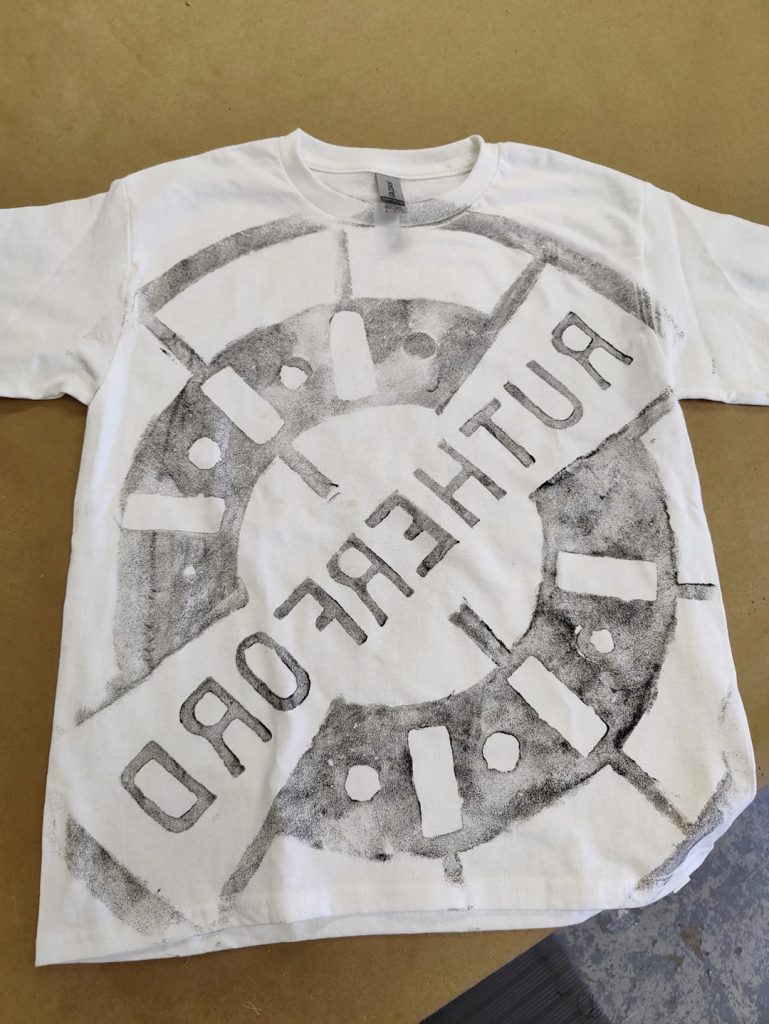 T-shirt relief printed from Rutherford manhole cover
